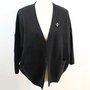 black cardigan with bee detail